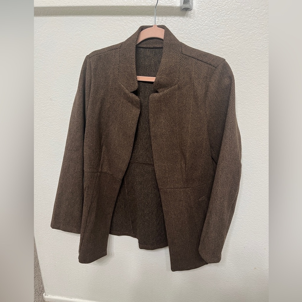 Like new Brown light coat.